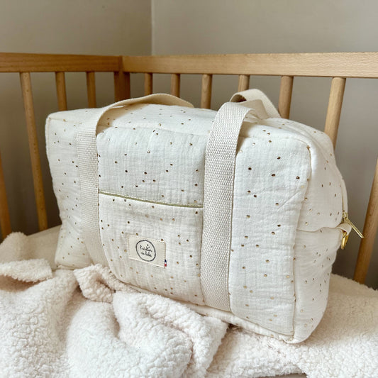 PETIT SAC A LANGER EN GAZE DE COTON A POIS DORÉ AVEC ANSES EN TOILE DE COTON DE QUALITÉ , SYSTEM D'ACCROCHE POUR BANDOULIERE DORÉ ET ZIP DORÉ